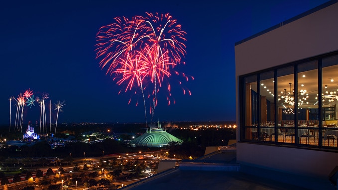 A fireworks display over Space Mountain and Cinderella Castle at Magic Kingdom park in Florida