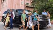 A family of 6 steps out of an SUV by Hollywood Tower Hotel at Disney's Hollywood Studios Park